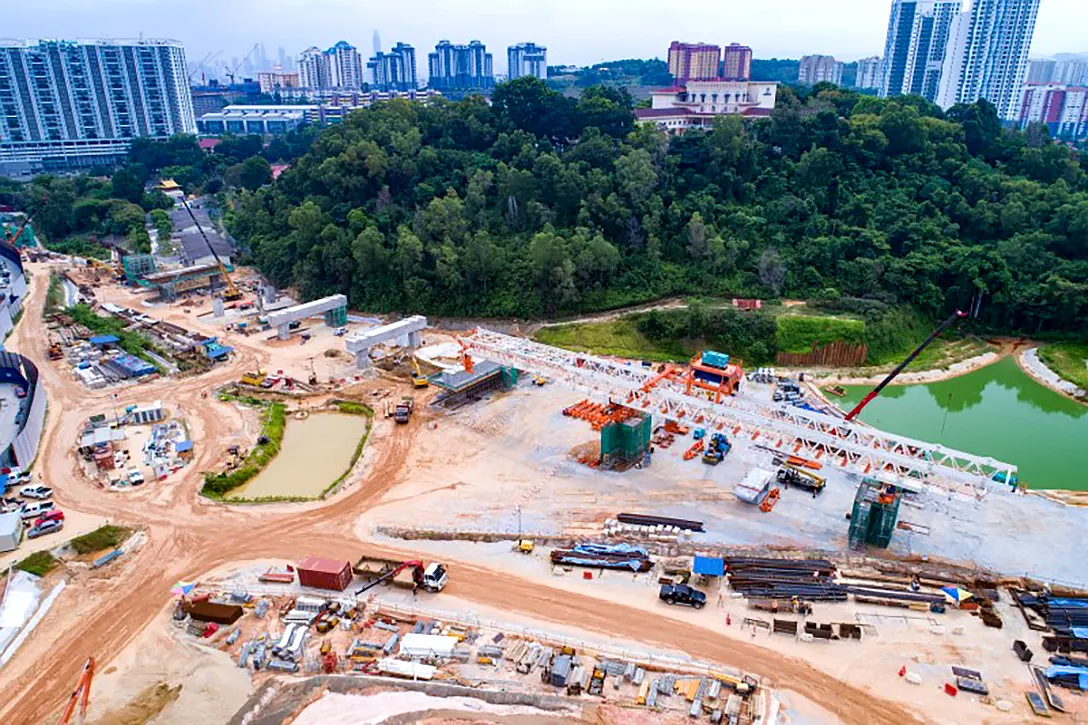 Aerial view of portal beam construction and erection of launching gantry at the Taman Naga Emas MRT Station.