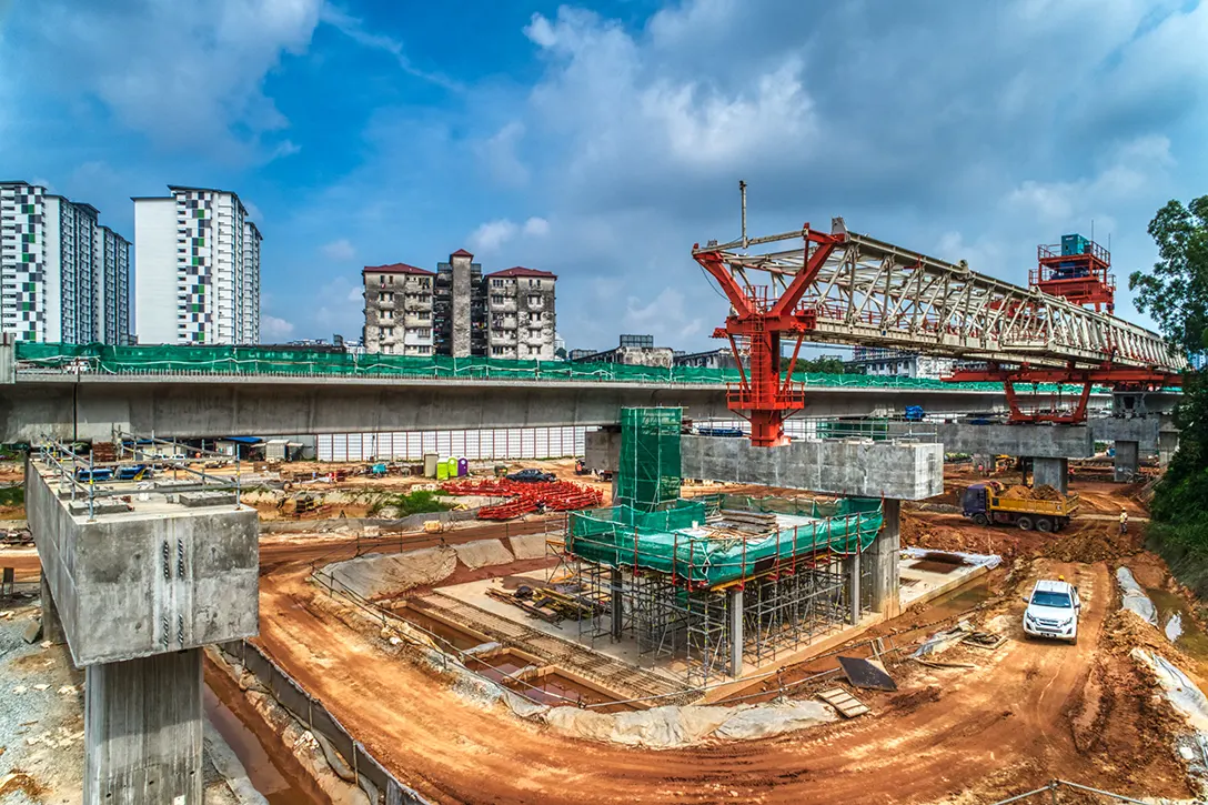 Aerial view of the launching of segmental box girder and station concourse works at the Taman Naga Emas MRT Station site.