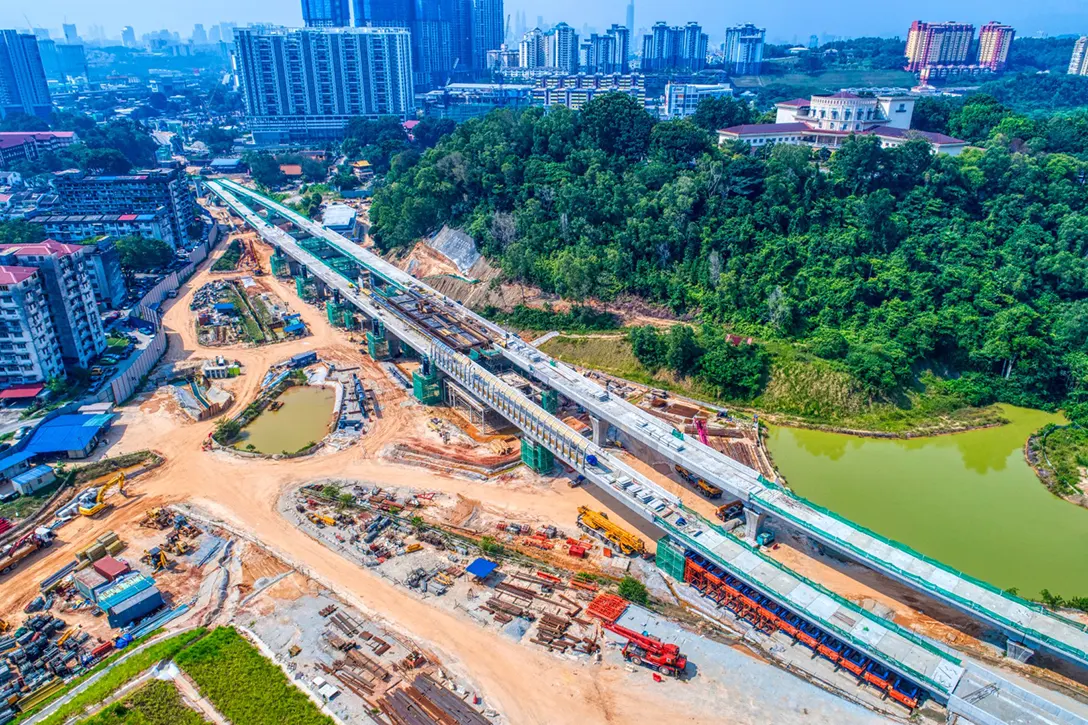 Aerial view of the Taman Naga Emas MRT Station site showing the station platform level works in progress.