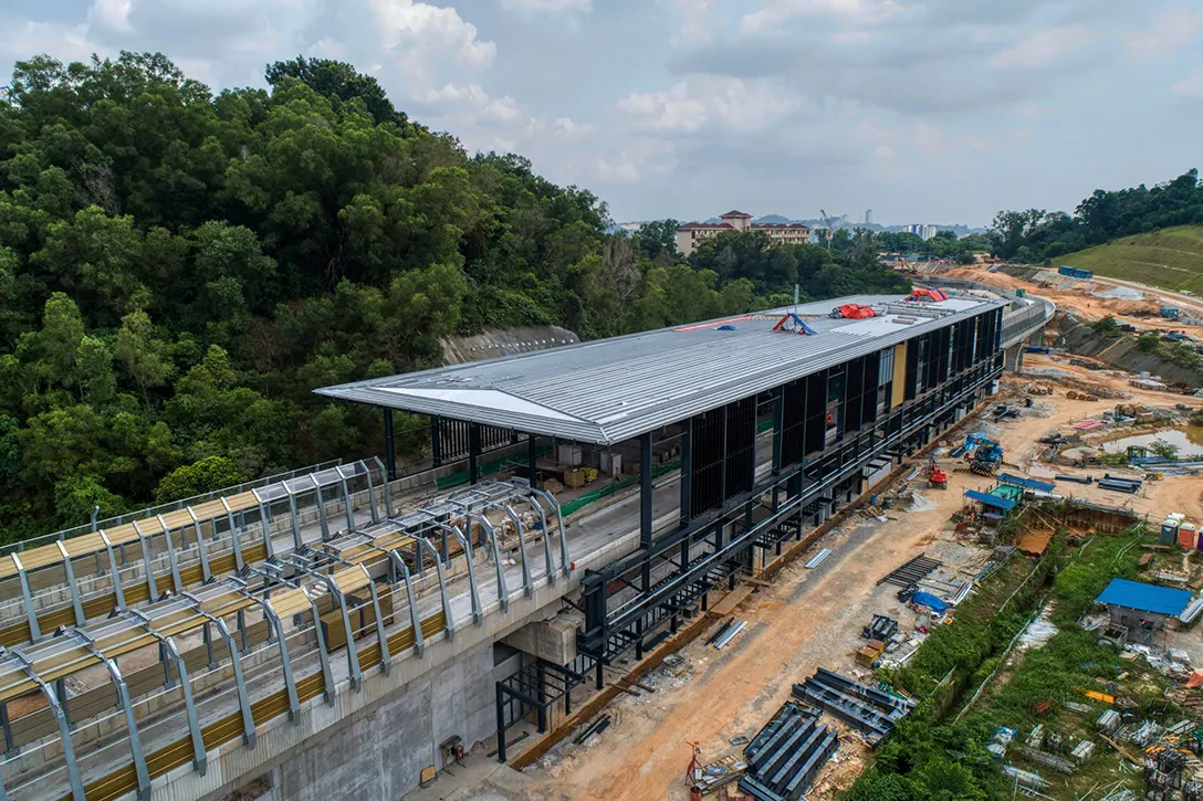 Aerial view of the ongoing installation of façade and roof sheeting at the Taman Naga Emas MRT Station site.