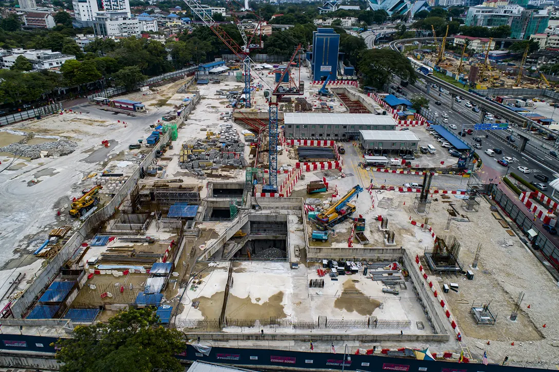 Aerial view of the Titiwangsa MRT Station showing the ongoing construction works such as rebar and concreting works for internal wall at concourse level, lower ground level and station entrance. Architectural works and mechanical and electrical works in progress can also be seen.
