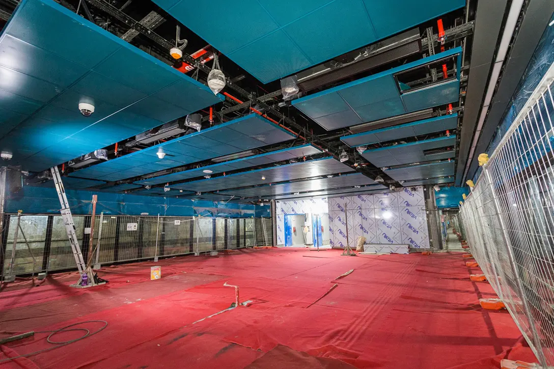 Ceiling perforated panel and linear lighting installation in progress at the Titiwangsa MRT Station.