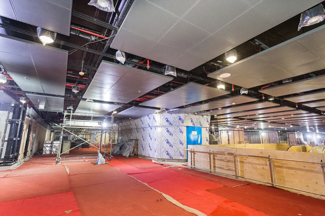 Ceiling perforated panel and linear lighting installation in progress at the Titiwangsa MRT Station concourse level.