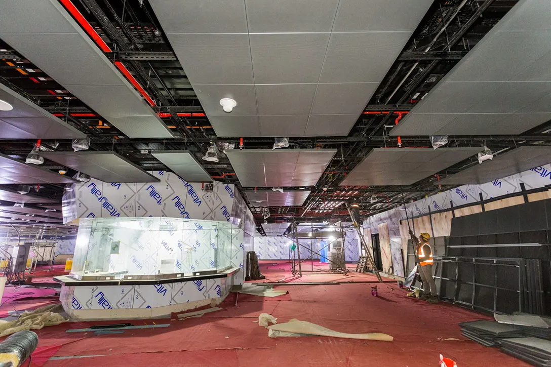 Ceiling perforated panel and linear lighting installation works coming towards completion at the concourse level of Titiwangsa MRT Station.