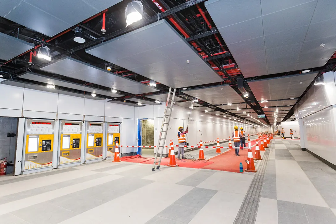 View of the concourse level connecting towards Entrance B of the Titiwangsa MRT Station. Final alignment of mechanical, electrical and plumbing services in progress.