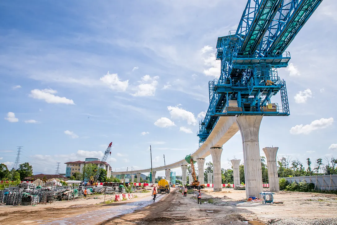 Segmental box girder launching in progress at the UPM MRT Station site.