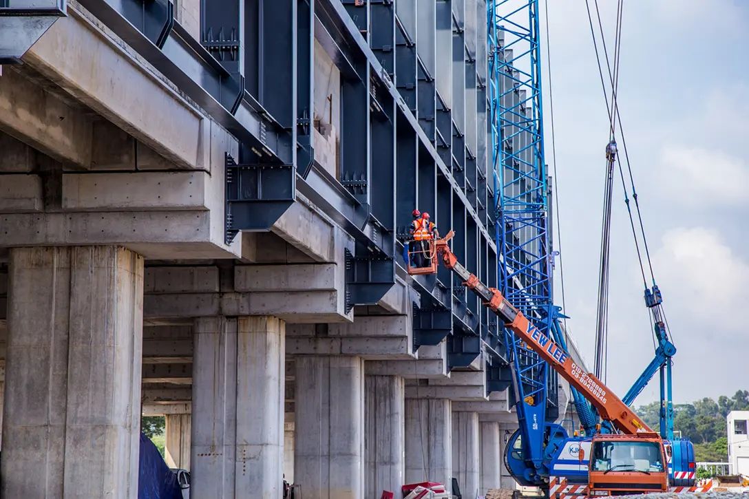 Roof truss installation works in progress at the UPM MRT Station.