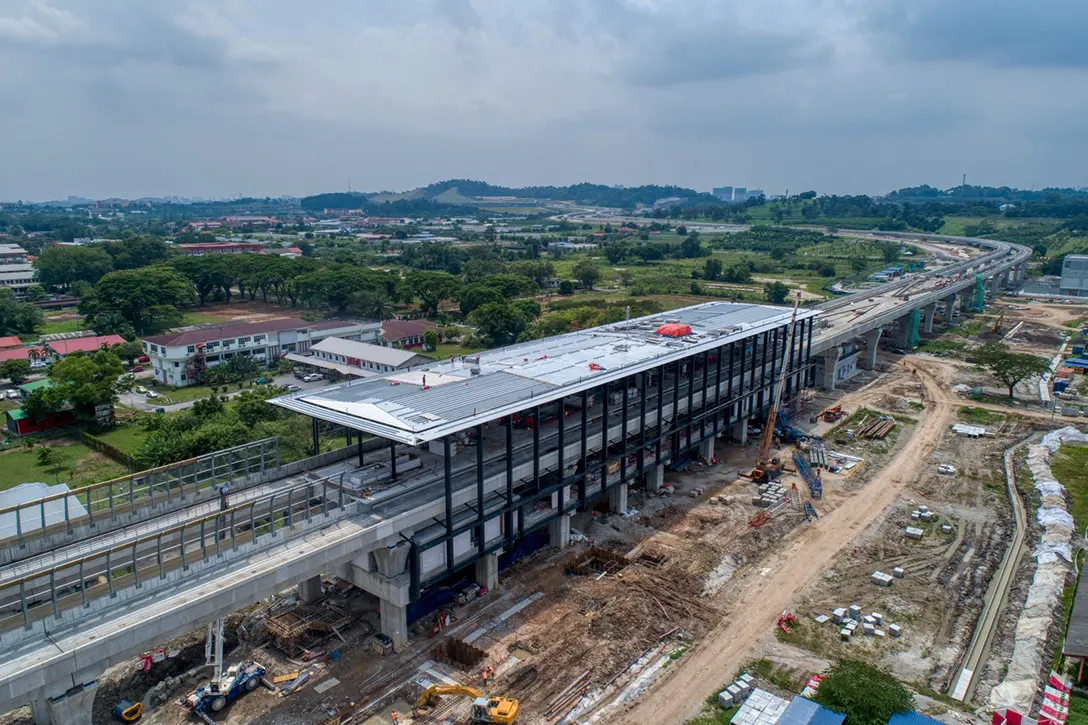 Aerial view of the UPM MRT Station site showing the installation of roof truss and steel structure in progress.