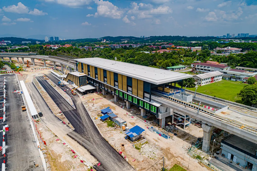 Aerial view of the UPM MRT Station showing the station façade mesh installation works in progress.