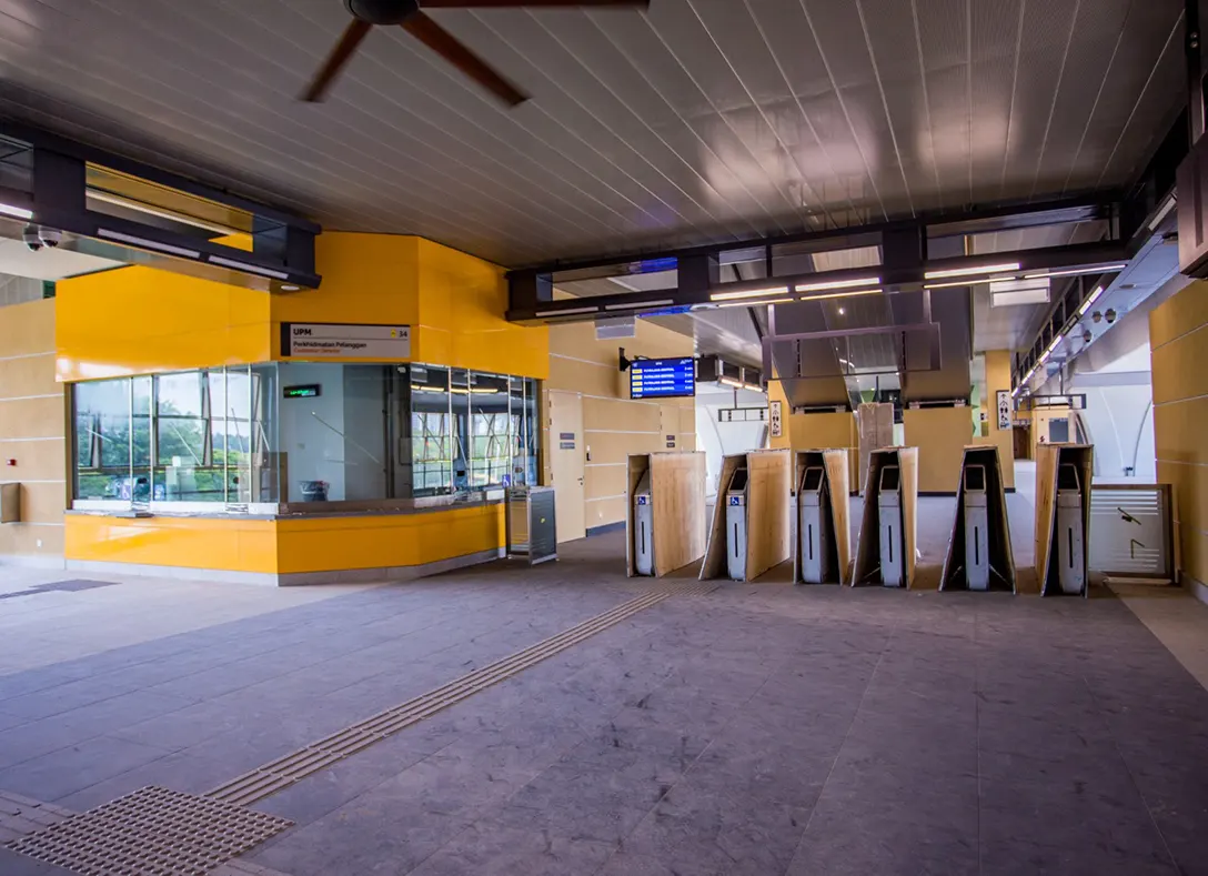 Installation of Automatic Fare Collection gate system in progress at the UPM MRT Station.