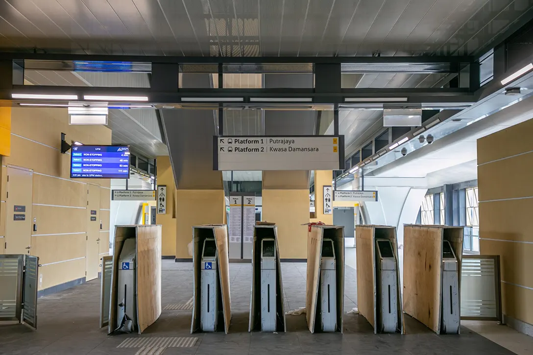 Testing and commissioning of Automatic Fare Collection gate system in progress at the UPM MRT Station.