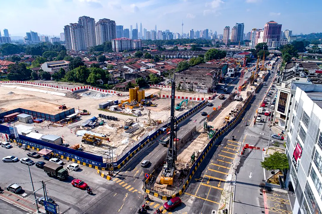 Aerial view of preparation for construction and bored piling works at the Kentonmen MRT Station site