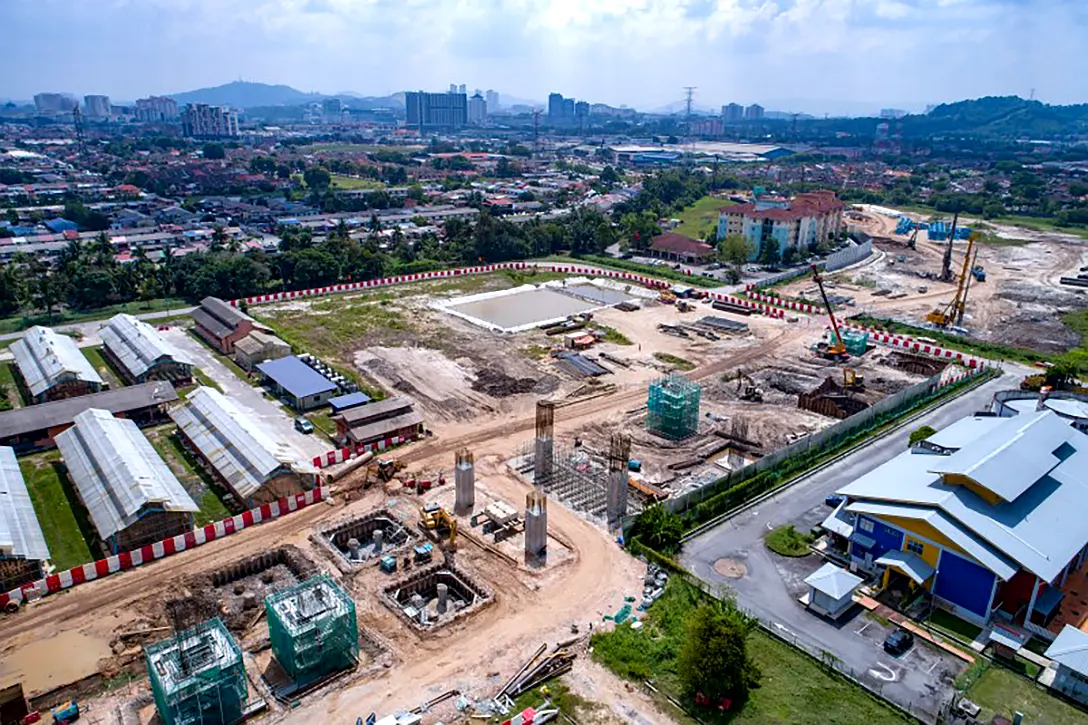 Aerial view of pile caps and piers construction at the UPM MRT Station site.