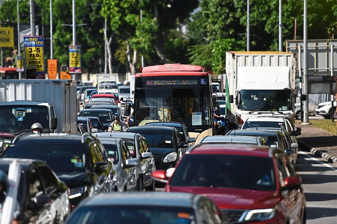 Chock-a-block: Penang’s vehicular saturation often results in public buses being trapped in traffic snarls. — KT GOH/The Star